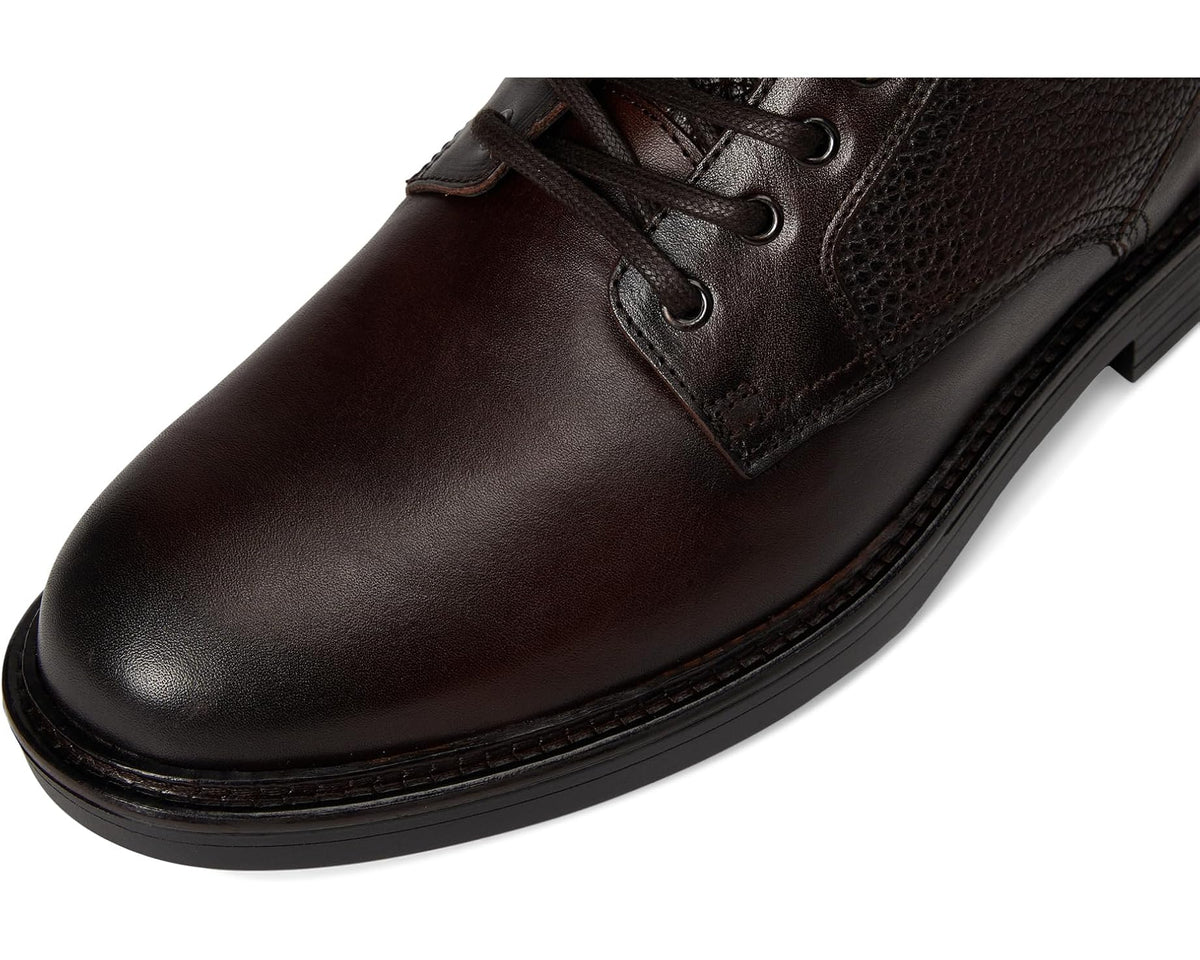 Dark brown leather lace-up boot with padded tongue and metal eyelets