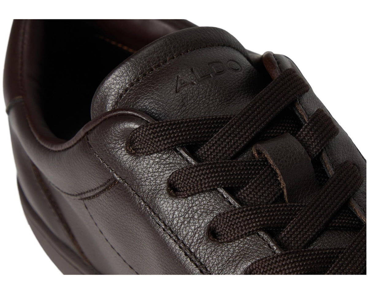 Brown lace-up sneaker close-up with textured ALDO branding on the tongue