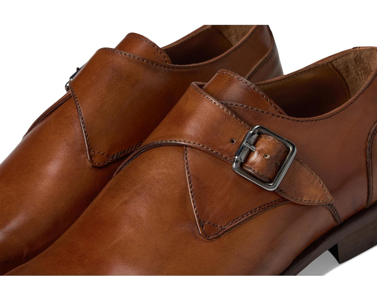 Men's brown leather monk strap dress shoe, close-up of buckle and stitching