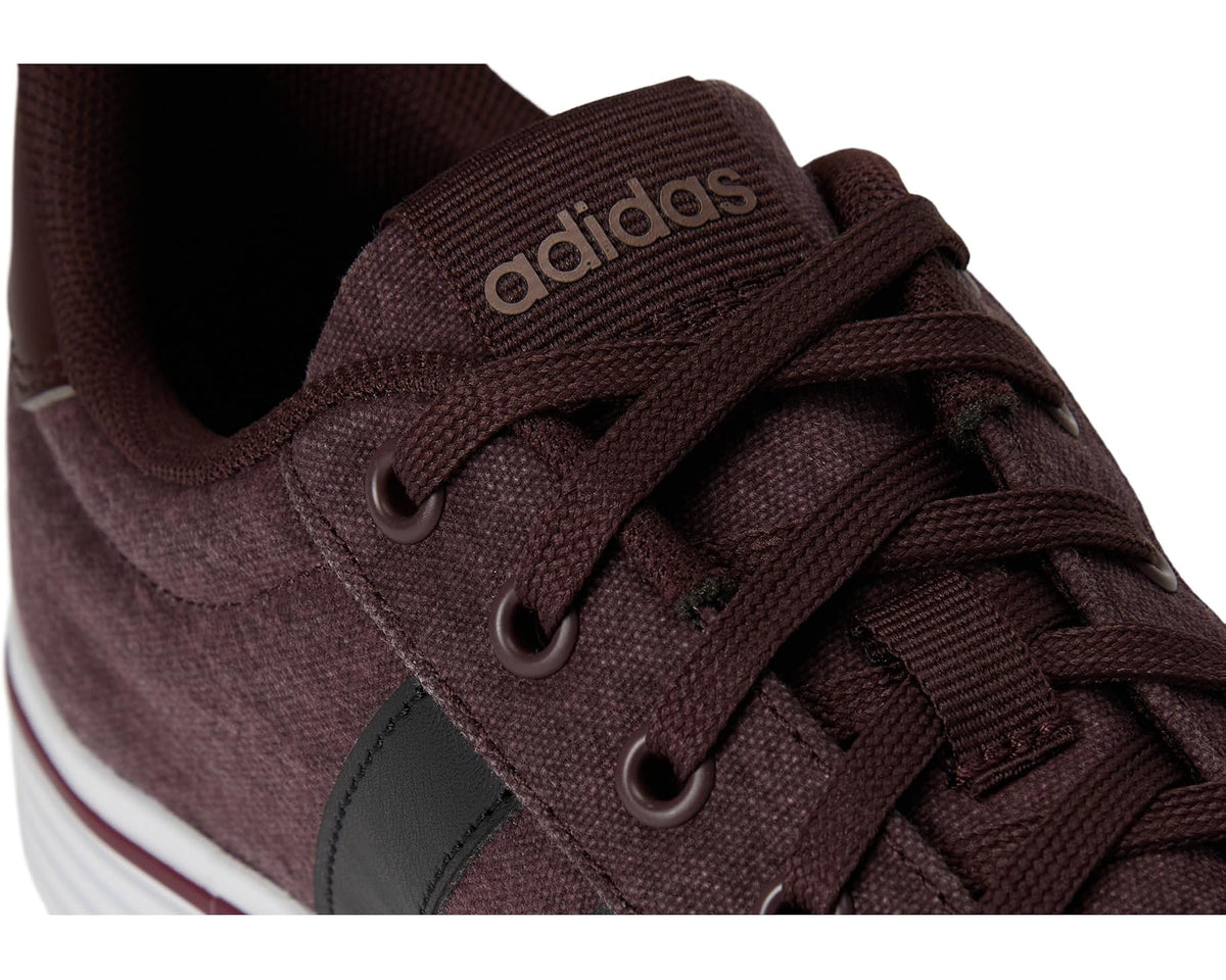 Unisex adidas laces and eyelets on dark brown fabric upper with black stripe detail