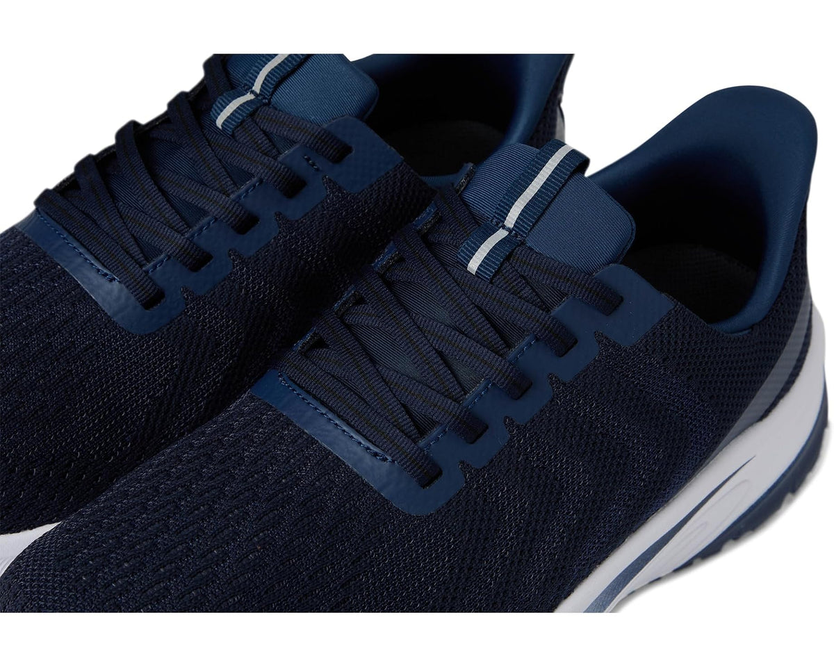 Navy knit upper close-up with lace eyelets and light-blue side strip