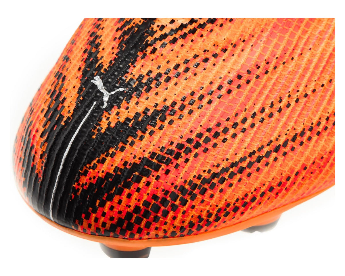 PUMA men's soccer cleat close-up: orange textured upper with black side panel