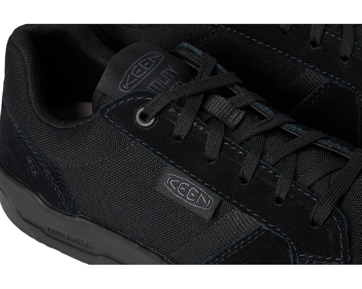 Black KEEN work shoe close-up, lace-up front with stitched overlays and ESD branding.