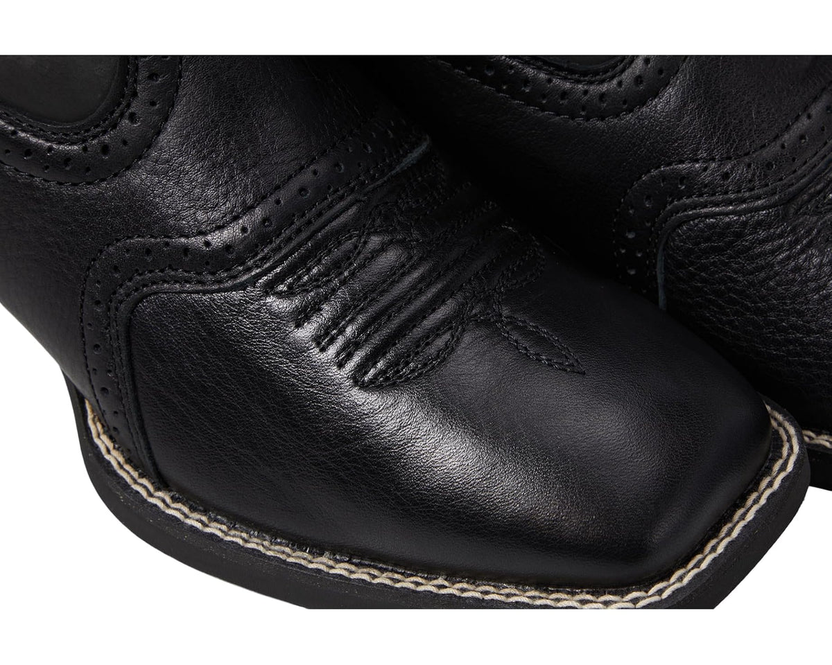 Black leather western boot close-up with stitched toe cap and decorative trim