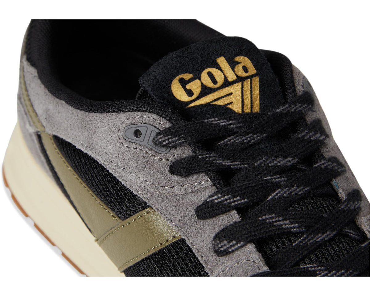 Gola Delta lace-up close-up with Gold logo on black tongue and black laces