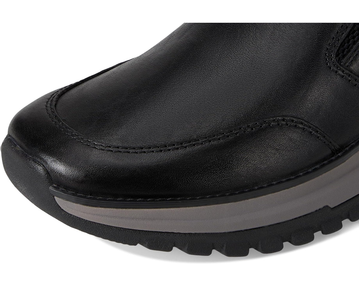 Men's black leather slip-on boot upper with stitched seams and textured grain