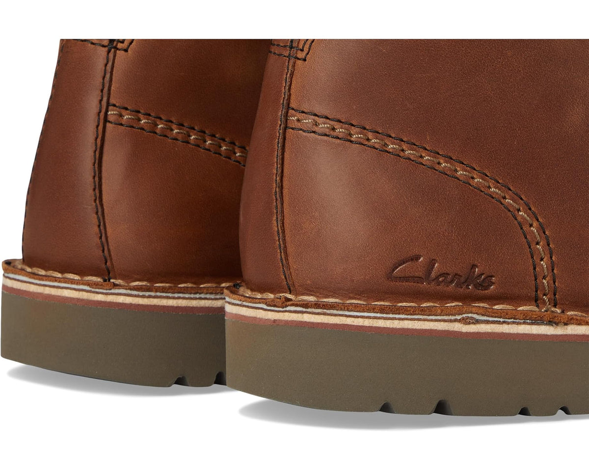 Men's Clarks leather chukka boot close-up, stitched seams and side logo