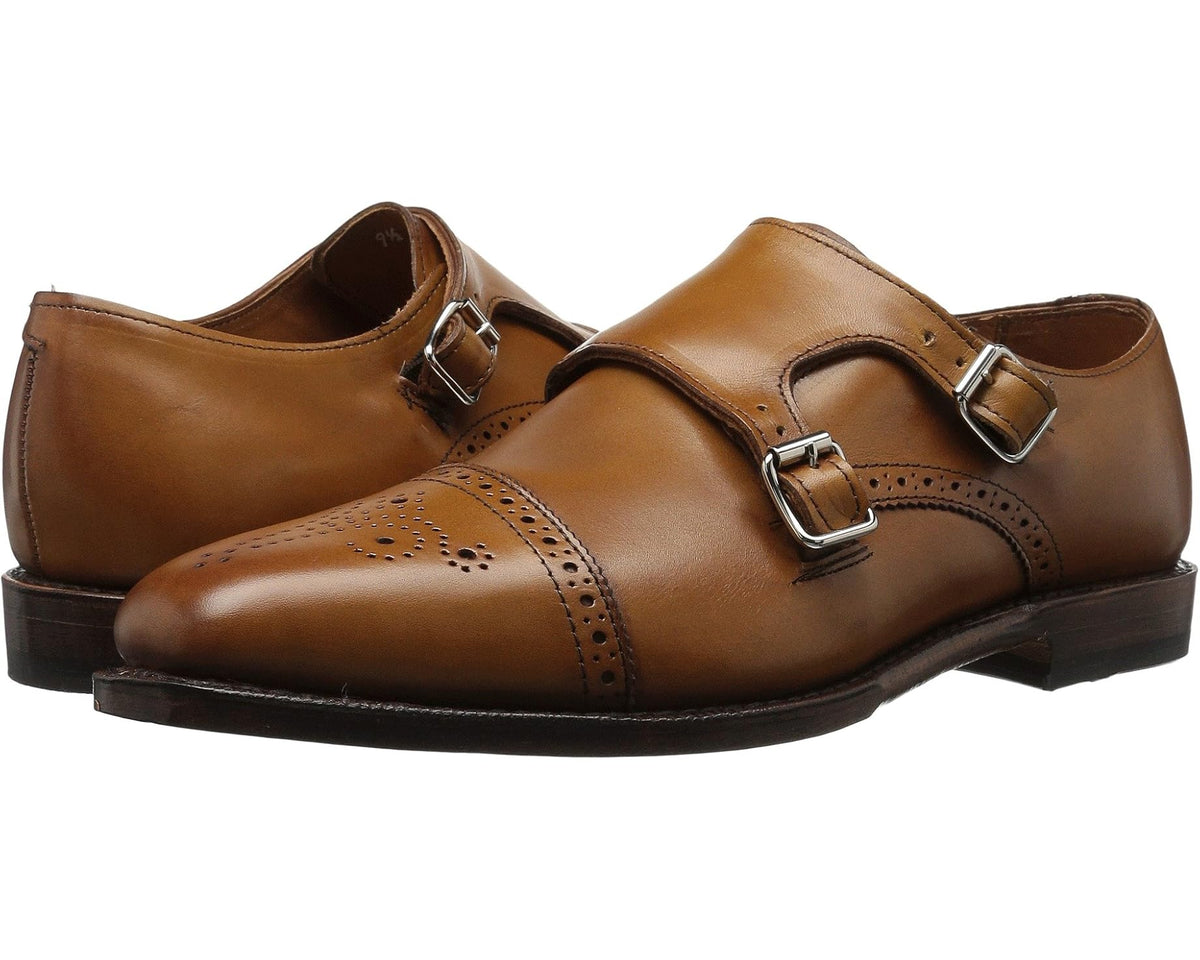 Men's walnut brown leather monk strap shoes with two buckle straps and brogue accents
