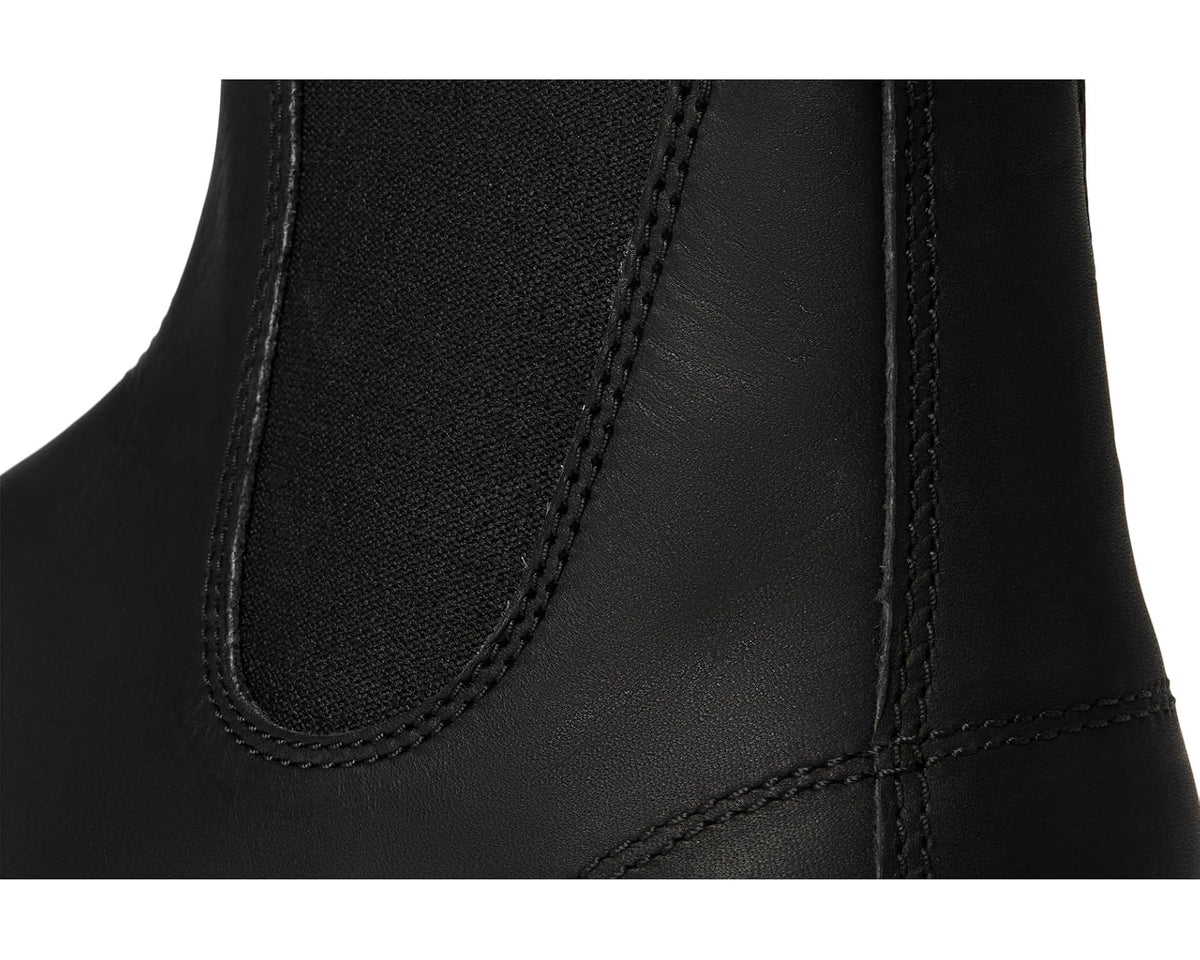 Black leather Chelsea boot upper close-up with stitched elastic gore