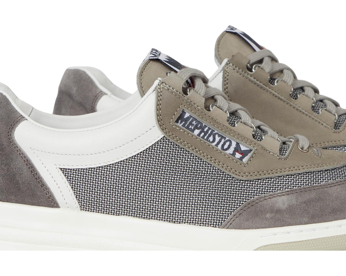 Close-up of grey mesh and suede sneaker with Mephisto logo on tongue