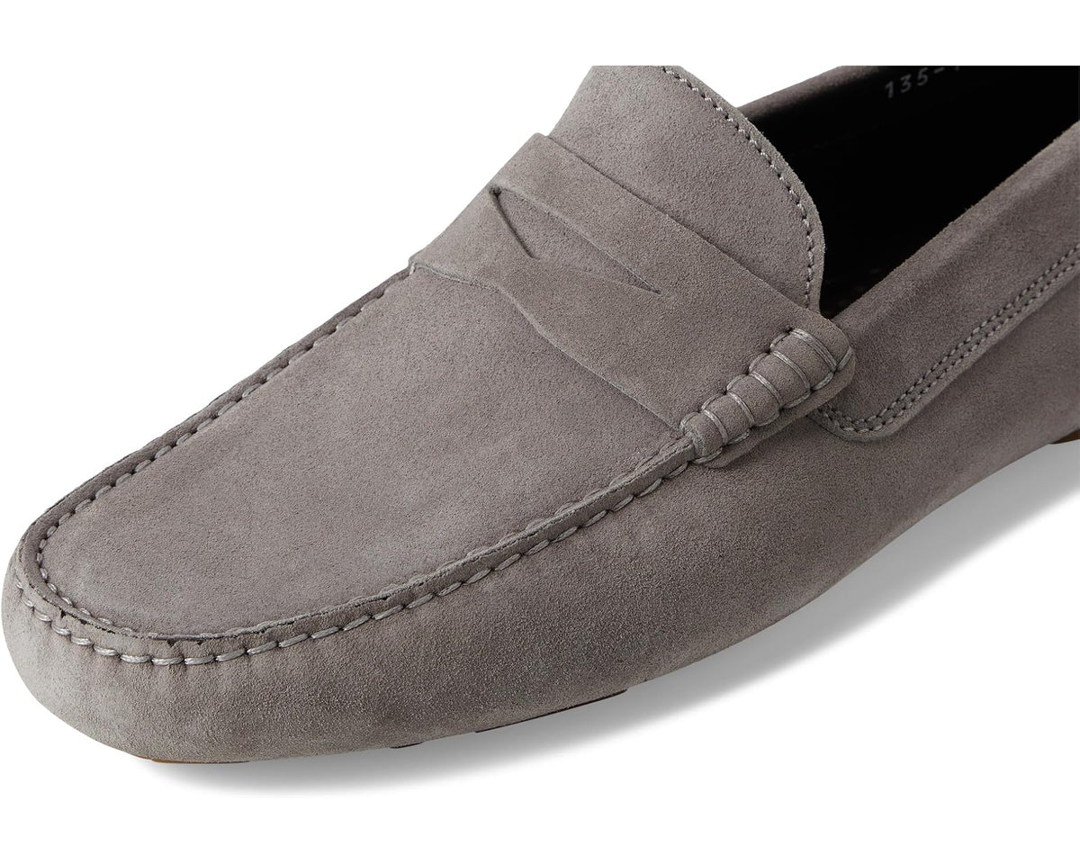 Grey suede men's loafer with elastic gore, moc stitching, and dark interior
