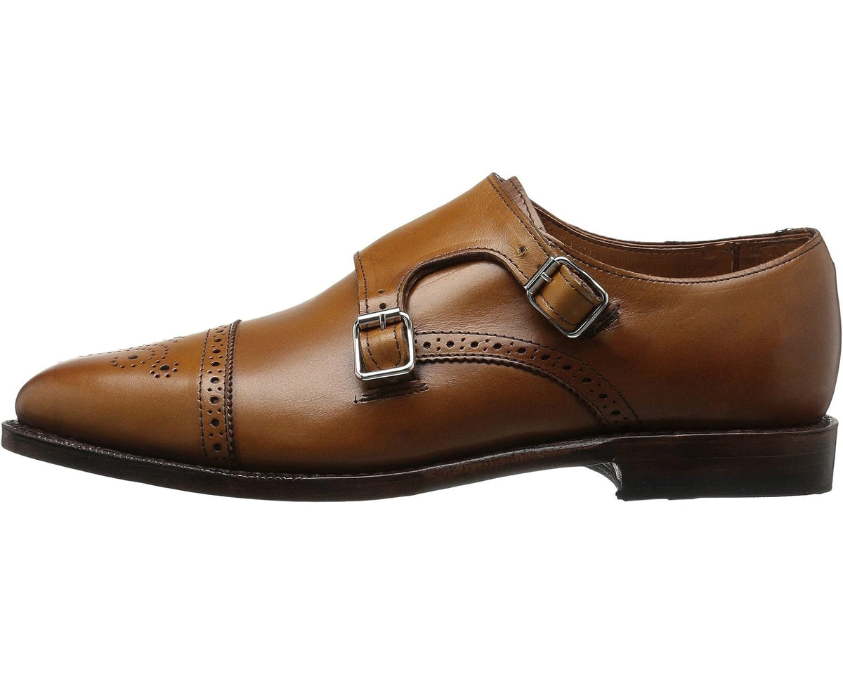 Men's walnut leather monk strap shoe with dual buckle straps and wingtip brogue