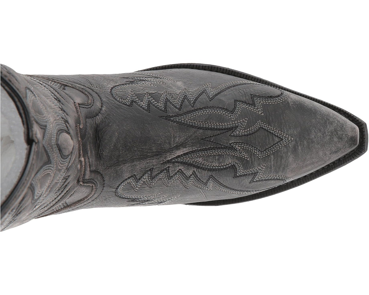 Black cowboy boot shaft detail with embossed stitch pattern and textured finish