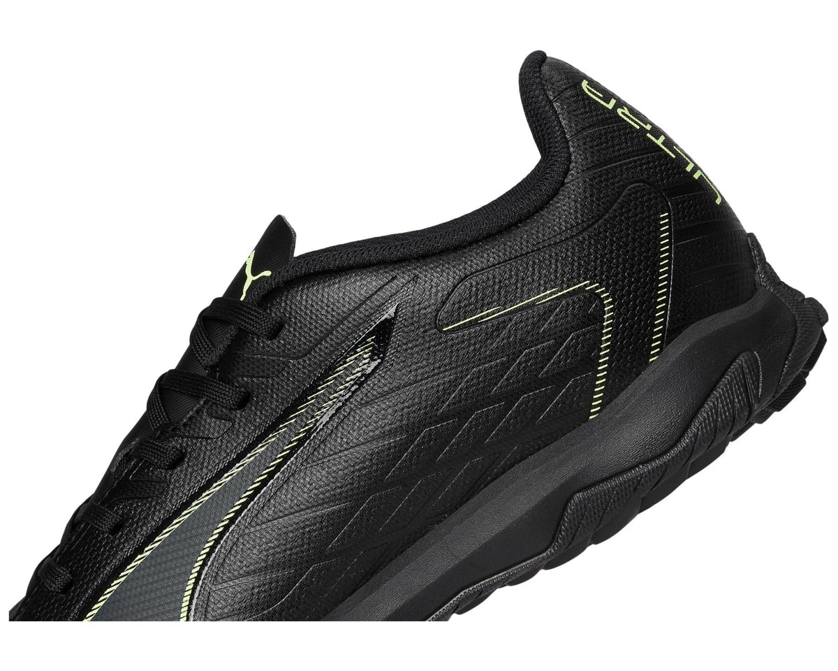 Black PUMA turf soccer cleat upper with laces and neon green logo detail