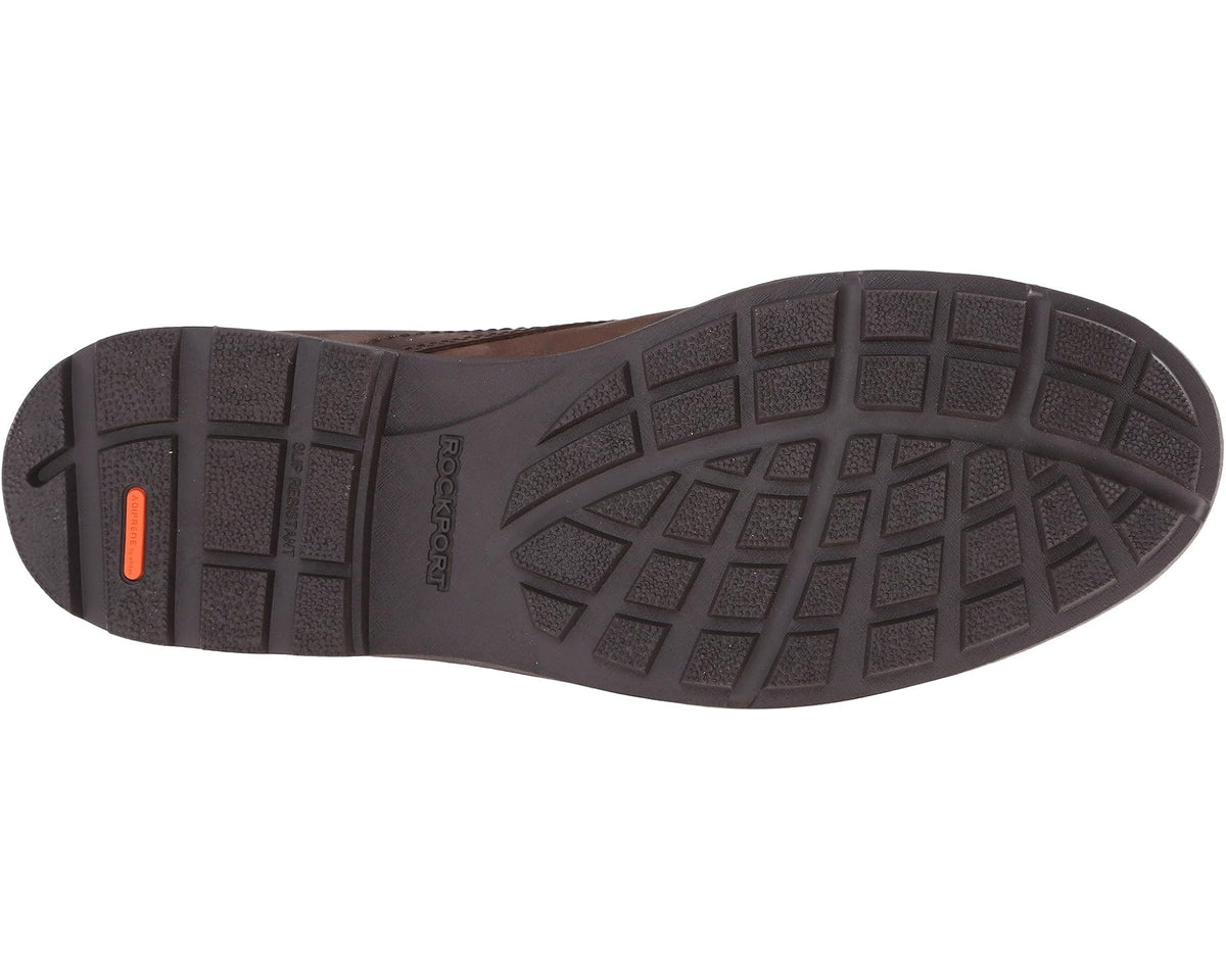 Rubber lug outsole for tan lace-up boots with Rockport logo on heel