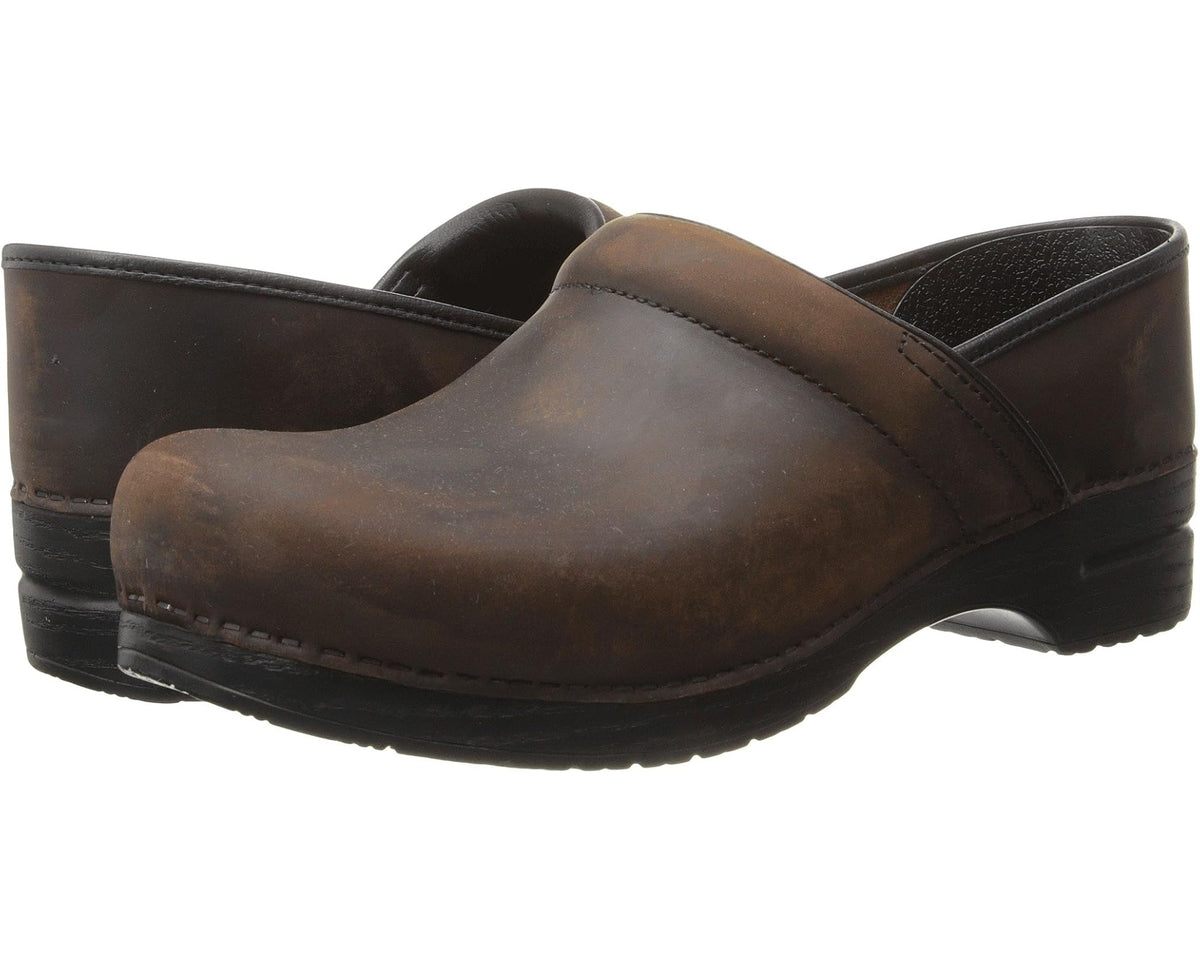 Dansko men's clog in antique brown oiled leather, slip-on with comfort outsole