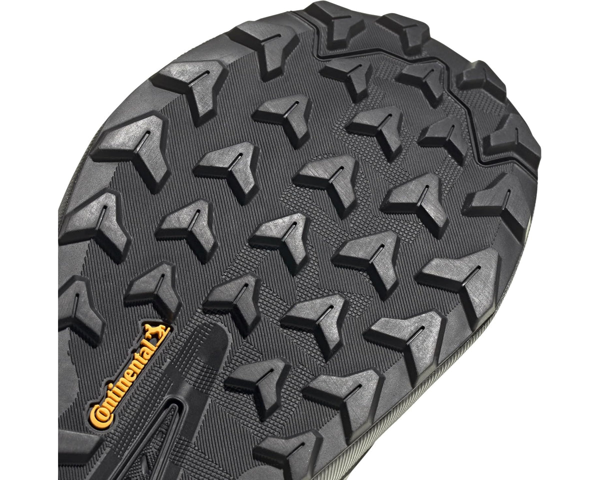 Men's hiking shoe outsole close-up with textured lugs for grip