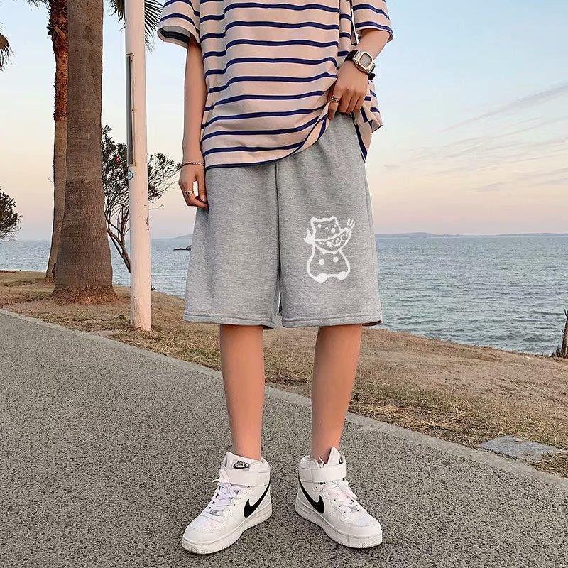 Gray straight sports shorts with white cartoon cat graphic on the leg