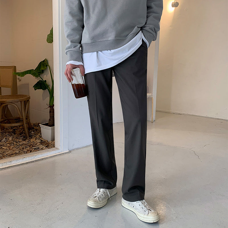 Charcoal loose straight trousers with relaxed fit and straight, draping leg