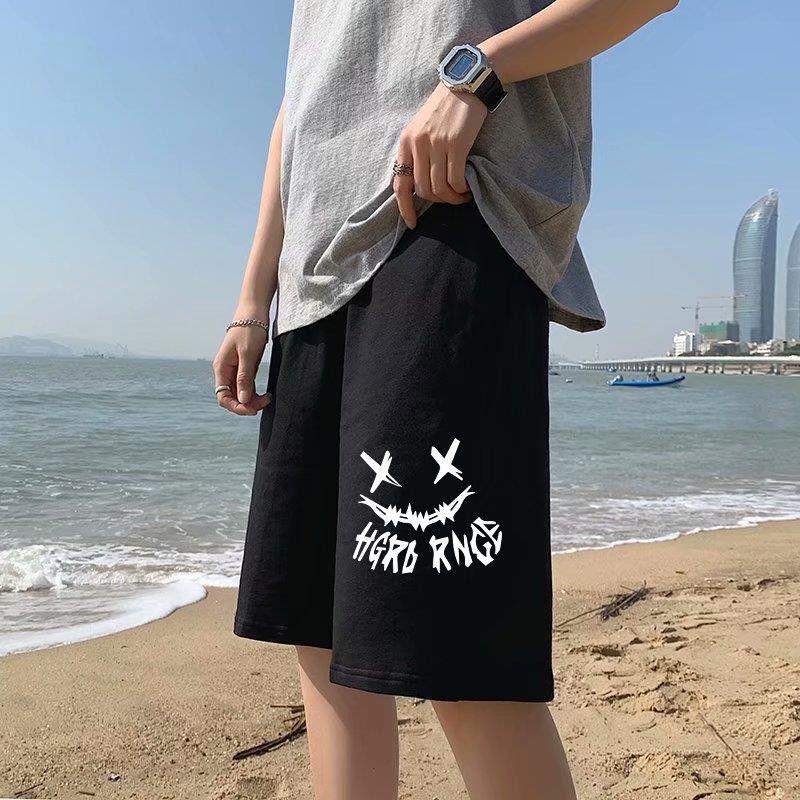 Black straight sports shorts with white skull-motif graphic and stylized text