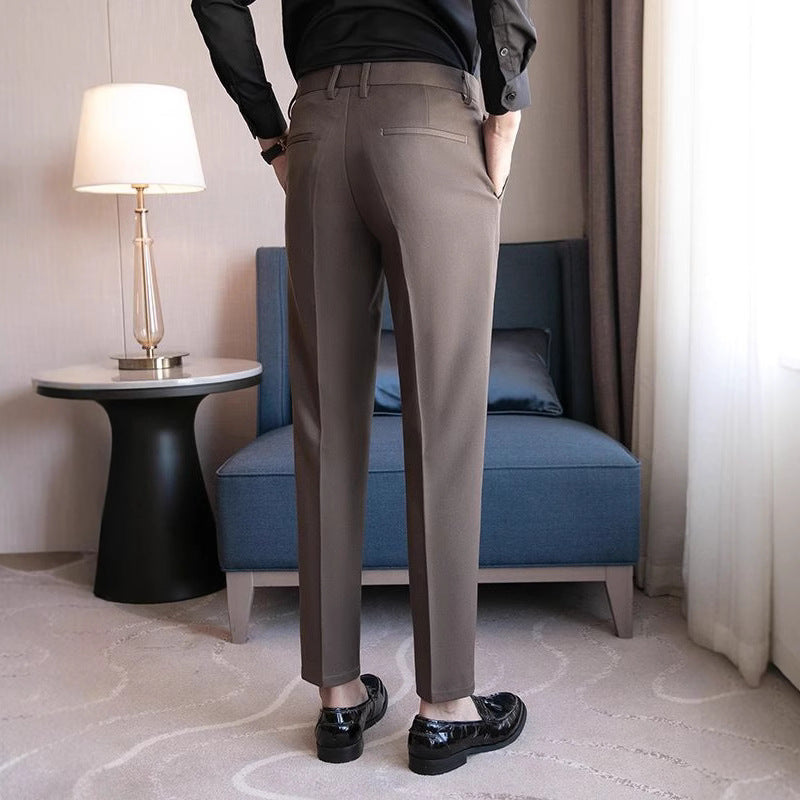 Men's dress pants in dark gray, flat front with belt loops and tailored crease